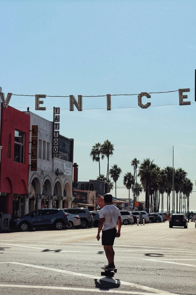 Skater in from of Venice Sign