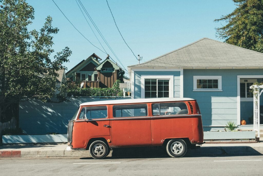 VW bus parked in front of craftsman house